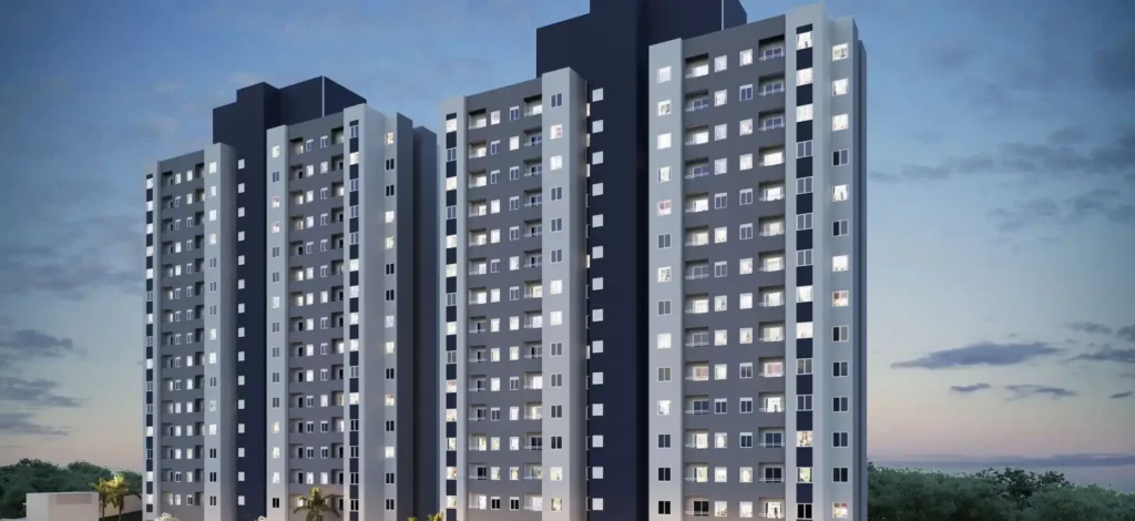 Imagem de um conjunto de edifícios residenciais altos à noite, mostrando janelas iluminadas, representando a importância de obedecer às regras do condomínio.